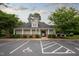 Community pool house featuring covered entryway and parking at 306 Plank Bridge Way, Morrisville, NC 27560