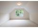 A carpeted room with a window that provides lots of natural light at 306 Plank Bridge Way, Morrisville, NC 27560