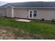 Backyard with a small concrete patio and a freshly-mowed lawn at 31 Kevior Ave, Four Oaks, NC 27524