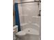 Clean shower features white surround and comfortable seating for accessibility at 31 Kevior Ave, Four Oaks, NC 27524