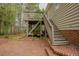Backyard featuring a brick patio, stairs, and deck with seating area at 318 Tillamook Dr, Wake Forest, NC 27587