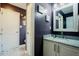 Modern bathroom features a white vanity with granite countertop, and contemporary lighting at 318 Tillamook Dr, Wake Forest, NC 27587