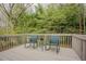 Relaxing outdoor deck featuring rocking chairs and views of a lush, green landscape at 318 Tillamook Dr, Wake Forest, NC 27587