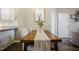 Modern dining area with wooden table, light paint and laminate flooring at 318 Tillamook Dr, Wake Forest, NC 27587