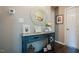 Charming entryway with stylish blue console table, decorative mirror, and framed artwork at 318 Tillamook Dr, Wake Forest, NC 27587