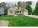 Charming one-story home with a manicured lawn and a cozy front porch and attached garage at 318 Tillamook Dr, Wake Forest, NC 27587