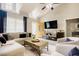 Bright and airy living room featuring a vaulted ceiling, wood flooring, and a cozy sectional sofa at 318 Tillamook Dr, Wake Forest, NC 27587