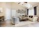 Bright and airy living room featuring a vaulted ceiling, wood flooring, and a cozy sectional sofa at 318 Tillamook Dr, Wake Forest, NC 27587