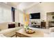 Bright and airy living room featuring a vaulted ceiling, wood flooring, and a cozy sectional sofa at 318 Tillamook Dr, Wake Forest, NC 27587