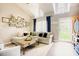 Bright and airy living room featuring a vaulted ceiling, wood flooring, and a cozy sectional sofa at 318 Tillamook Dr, Wake Forest, NC 27587
