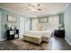 Cozy main bedroom with neutral paint, decorative rug and lots of natural light at 318 Tillamook Dr, Wake Forest, NC 27587