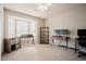 Well-lit office space with a big window, shelving, neutral colors, and carpet at 318 Tillamook Dr, Wake Forest, NC 27587