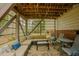 Covered patio with stone flooring, an outdoor seating area, and grill for entertaining guests at 318 Tillamook Dr, Wake Forest, NC 27587