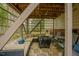 Covered patio with stone flooring, an outdoor seating area, and grill for entertaining guests at 318 Tillamook Dr, Wake Forest, NC 27587