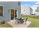 Backyard patio with an outdoor dining set with a view of the lawn at 320 Everly Mist Way, Wake Forest, NC 27587