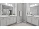Spacious bathroom featuring dual sinks, granite countertops, and well-lit mirrors at 320 Everly Mist Way, Wake Forest, NC 27587
