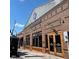 Brick building with large windows and signage indicating business presence in a commercial area at 320 Everly Mist Way, Wake Forest, NC 27587