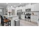Bright kitchen with stainless steel appliances, granite countertops, and a central island with seating at 320 Everly Mist Way, Wake Forest, NC 27587