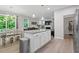 Open-concept living area with a view to the kitchen and dining space at 320 Everly Mist Way, Wake Forest, NC 27587
