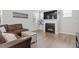 Inviting living room with a cozy fireplace and views of the backyard at 320 Everly Mist Way, Wake Forest, NC 27587