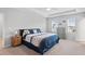 Spacious main bedroom with tray ceilings, plush carpet, and ensuite access at 320 Everly Mist Way, Wake Forest, NC 27587