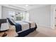 Bright main bedroom featuring a tray ceiling and ensuite access to the main bathroom at 320 Everly Mist Way, Wake Forest, NC 27587