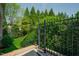 Landscaped backyard with black metal fencing and greenery at 3911 Morvan Way, Raleigh, NC 27612
