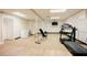 Finished basement area with exercise equipment, including a treadmill and weight bench at 3911 Morvan Way, Raleigh, NC 27612
