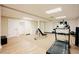 Finished basement with fitness area that features a treadmill, weight bench, and other exercise items at 3911 Morvan Way, Raleigh, NC 27612