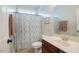 Bathroom featuring a toilet, patterned shower curtain, vanity and mirror at 3911 Morvan Way, Raleigh, NC 27612