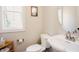 Cozy half bath featuring a pedestal sink and framed mirror at 3911 Morvan Way, Raleigh, NC 27612