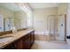 Bathroom with granite countertops, soaking tub and tiled shower with glass door, and tile flooring at 3911 Morvan Way, Raleigh, NC 27612