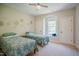 Bedroom featuring two twin beds, a window seat, and neutral wall decor at 3911 Morvan Way, Raleigh, NC 27612