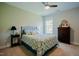 Bedroom featuring carpet flooring, a ceiling fan, a queen bed, and neutral color walls at 3911 Morvan Way, Raleigh, NC 27612
