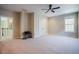 Empty bonus room with a ceiling fan, carpet flooring, and access to the hallway at 3911 Morvan Way, Raleigh, NC 27612