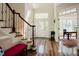 Elegant foyer with hardwood floors, staircase with ornate banister, and architectural details at 3911 Morvan Way, Raleigh, NC 27612