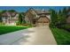 A two-story brick and siding home features a manicured lawn and a concrete driveway at 3911 Morvan Way, Raleigh, NC 27612