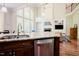 Open-concept kitchen with granite countertops, stainless appliances, and hardwood floors at 3911 Morvan Way, Raleigh, NC 27612