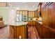 Gourmet kitchen featuring granite countertops, stainless steel appliances, and hardwood floors at 3911 Morvan Way, Raleigh, NC 27612