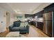 Lower-level kitchenette features stainless appliances and a cozy seating area at 3911 Morvan Way, Raleigh, NC 27612