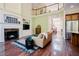 Elegant living room with fireplace, built-in shelving, and large windows providing natural light at 3911 Morvan Way, Raleigh, NC 27612