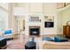 Inviting living room with a fireplace, built-in bookshelves, and hardwood floors at 3911 Morvan Way, Raleigh, NC 27612