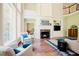Bright and airy living room with large windows, a fireplace, and comfortable seating at 3911 Morvan Way, Raleigh, NC 27612