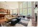 Open floor plan with seamless flow from the kitchen to the bright, window-lined living area at 3911 Morvan Way, Raleigh, NC 27612