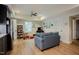 Lower-level kitchenette leads to a living space with a ceiling fan and plush seating at 3911 Morvan Way, Raleigh, NC 27612