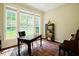 Bright home office space with large windows and hardwood floors at 3911 Morvan Way, Raleigh, NC 27612