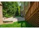 The brick patio features an outdoor fireplace and has stairs leading to a screened deck at 3911 Morvan Way, Raleigh, NC 27612