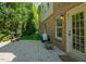 A spacious brick patio connects to the home's interior and includes an outdoor fireplace at 3911 Morvan Way, Raleigh, NC 27612
