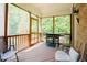 Outdoor screened porch featuring comfortable seating and a grill, perfect for entertaining at 3911 Morvan Way, Raleigh, NC 27612