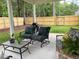 Inviting covered porch with outdoor furniture, perfect for relaxing and entertaining in the backyard at 4001 Newby Rd, Rocky Mount, NC 27804